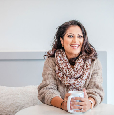 Beena Guide sitting in a coffee shop