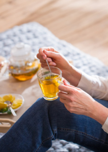 A woman drinking a healing elixir